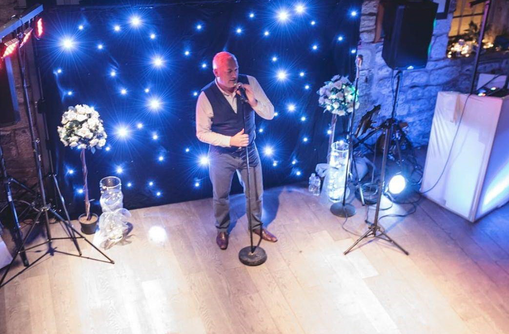 Ricky Shelton singing at a wedding reception